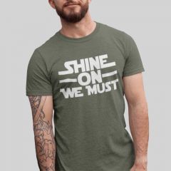 Shine on We Must in white on heather military green t-shirt.